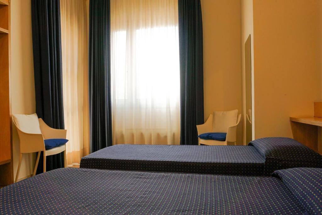 Postel nebo postele na pokoji v ubytování Albergo Ristorante Saverino