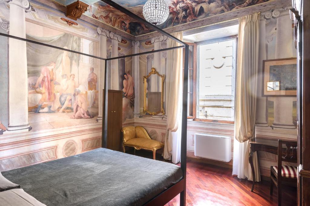 A bed or beds in a room at Domus Nannini SPA - Palazzo Nannini