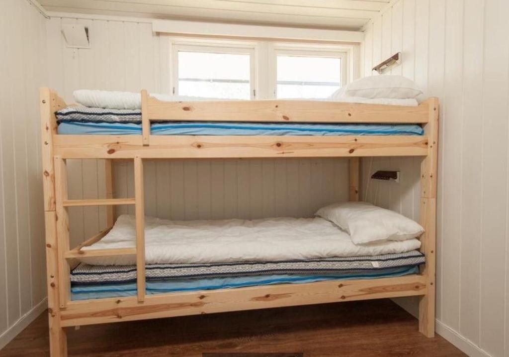 a couple of bunk beds in a room at Kjekstadveien 22 Homborsund in Jordtveit