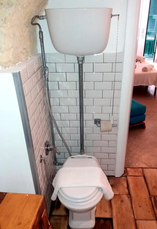 a bathroom with a toilet in a room at La casa di Adele in Syracuse