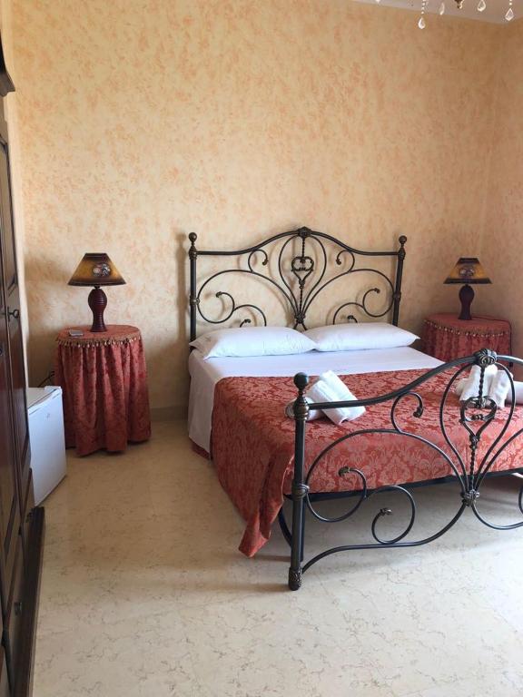 Postel nebo postele na pokoji v ubytování Villa Belvedere di Rita