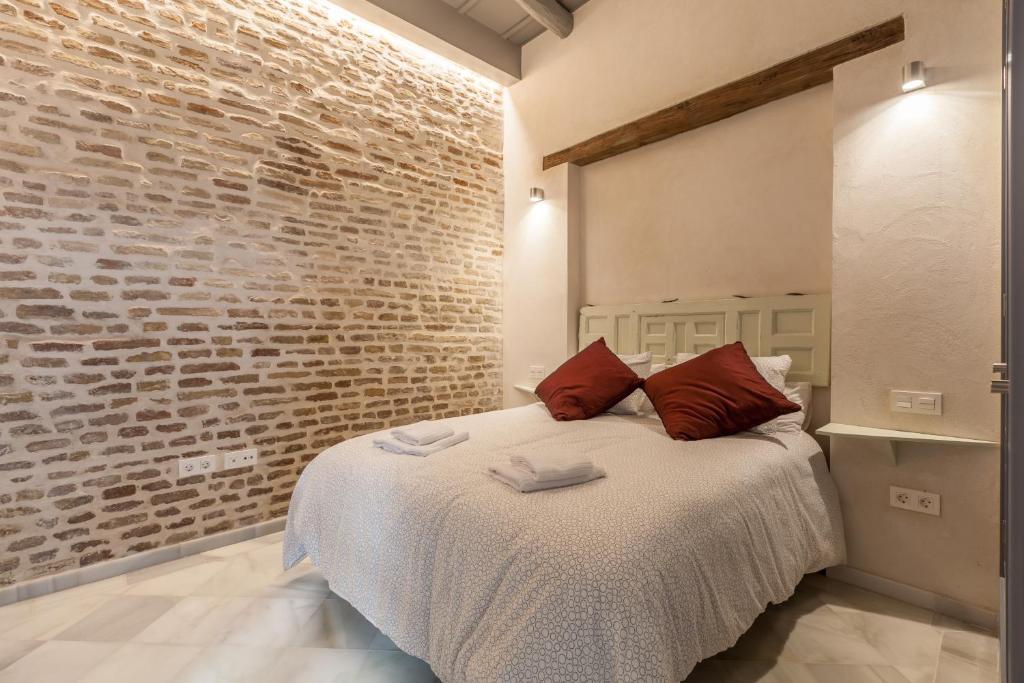 Postel nebo postele na pokoji v ubytování Casas de Sevilla - Apartamentos Tintes12