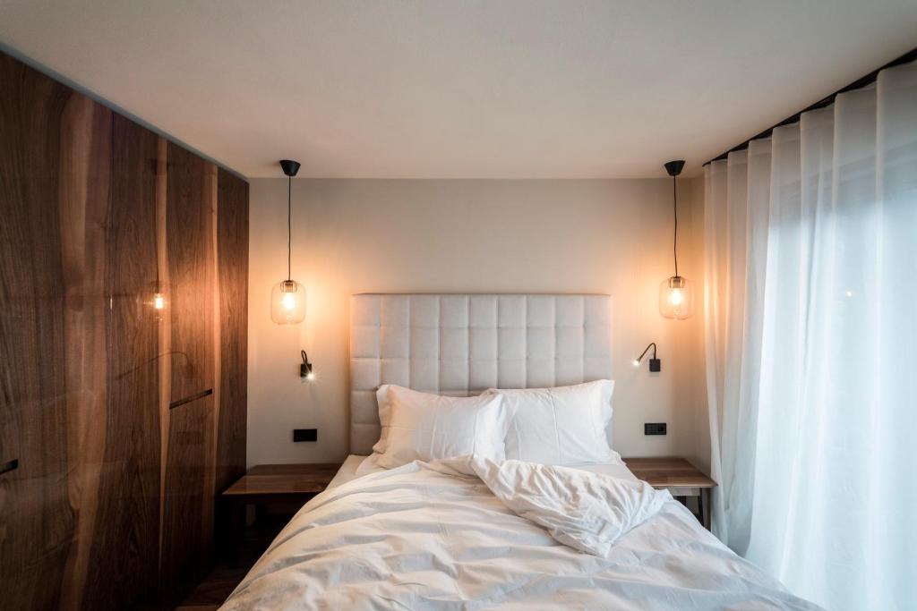 Postel nebo postele na pokoji v ubytování Messnerhaus Suite
