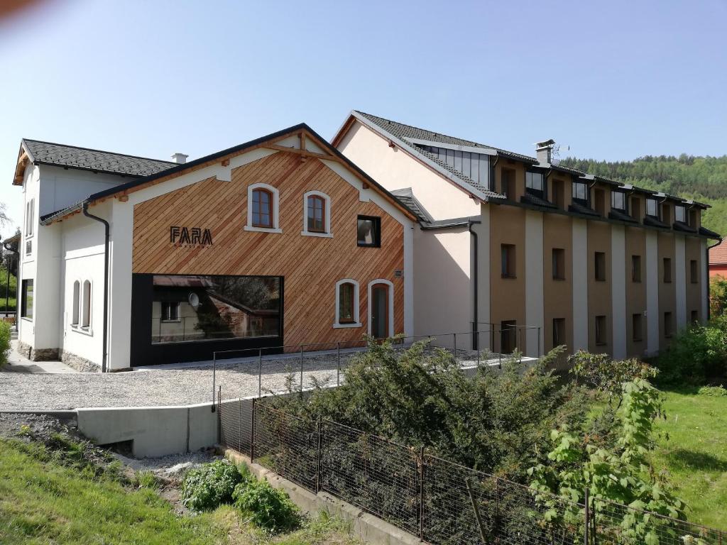 a house with a wooden facade at Apartmán U Zámku in Loučná nad Desnou