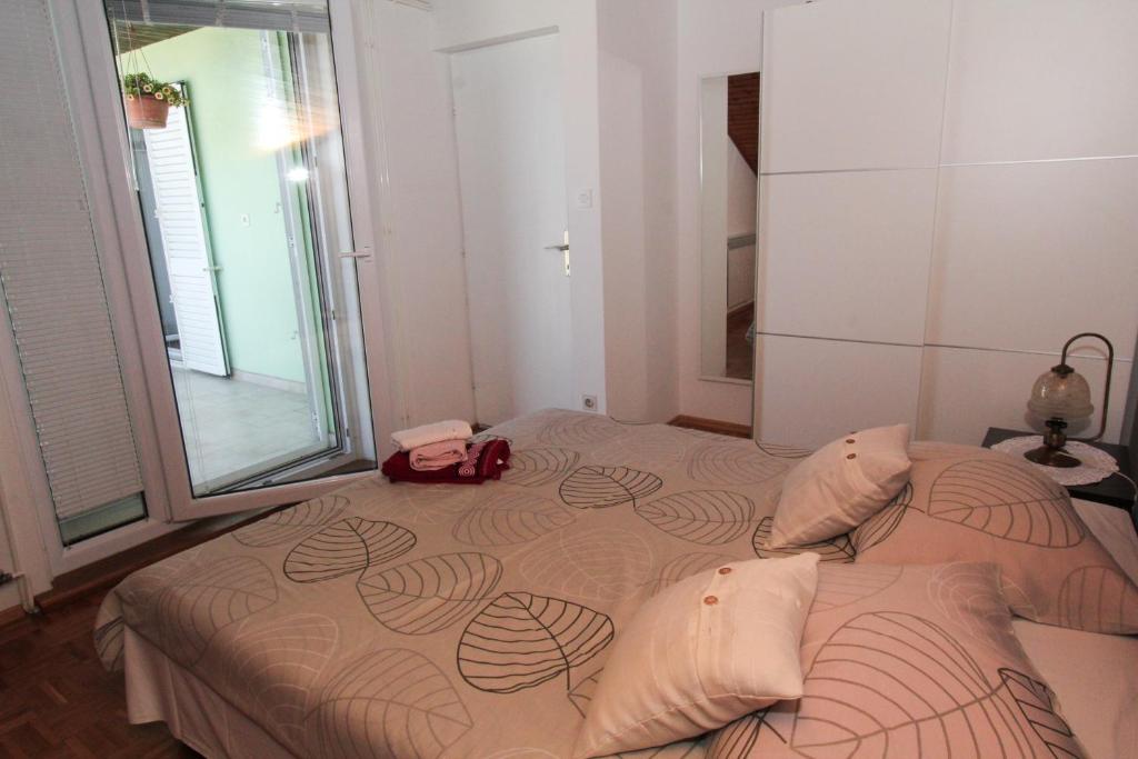 Postel nebo postele na pokoji v ubytování Apartment Vatrogasac