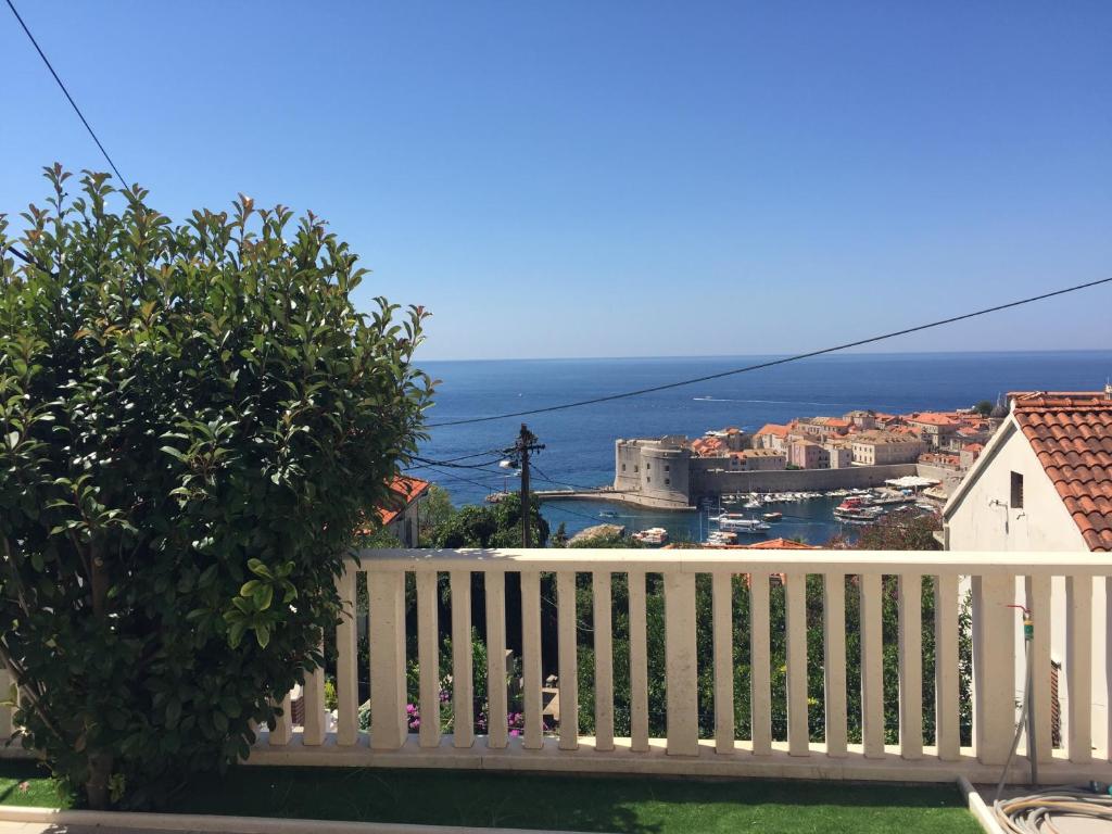 a view of the ocean from a balcony of a house at Villa Juliet in Dubrovnik