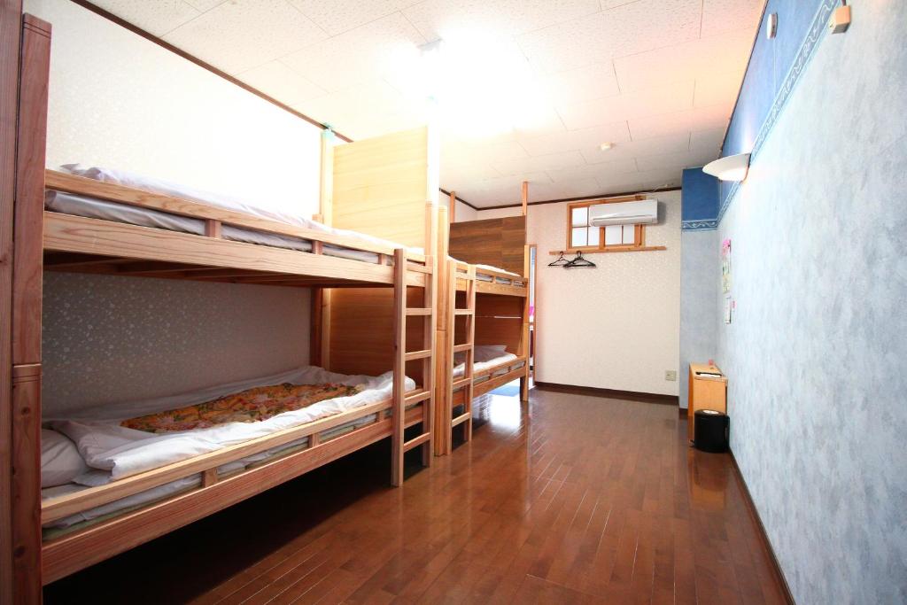 Postel nebo postele na pokoji v ubytování Ikkyu For Backpackers 19