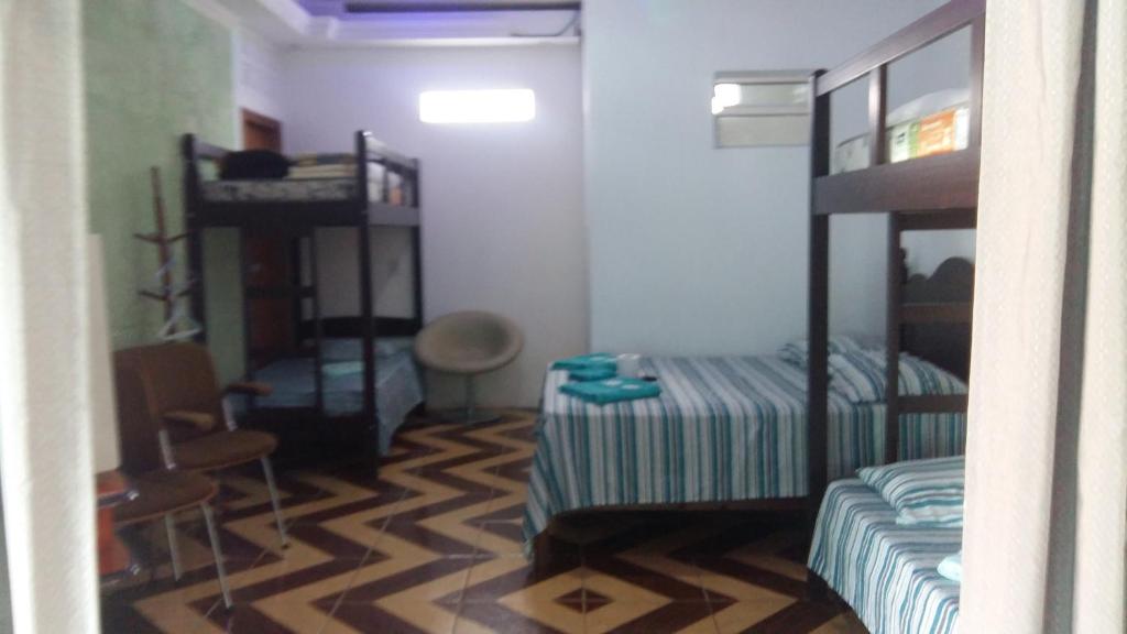 Ένα ή περισσότερα κρεβάτια σε δωμάτιο στο Pousada Recanto Dom Lázaro