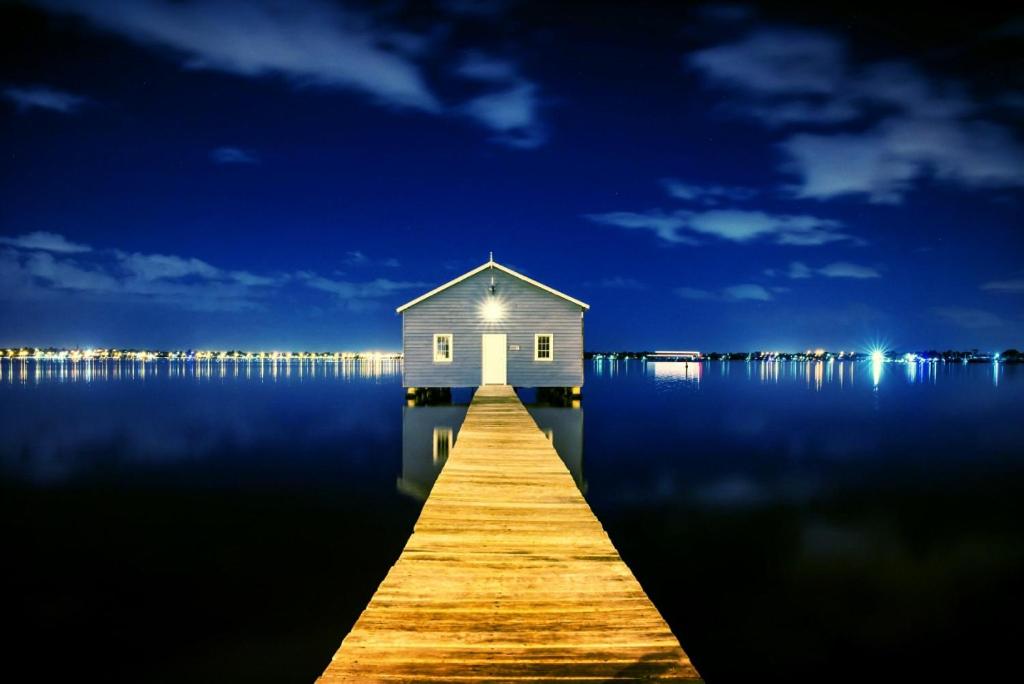 a house on a dock in the middle of the water at Perth City Retreat - free parking in Perth