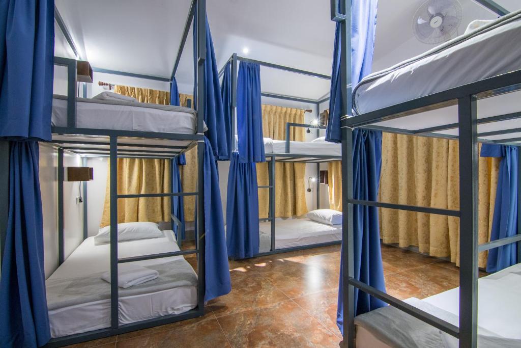 Postel nebo postele na pokoji v ubytování Bokre Angkor Hostel