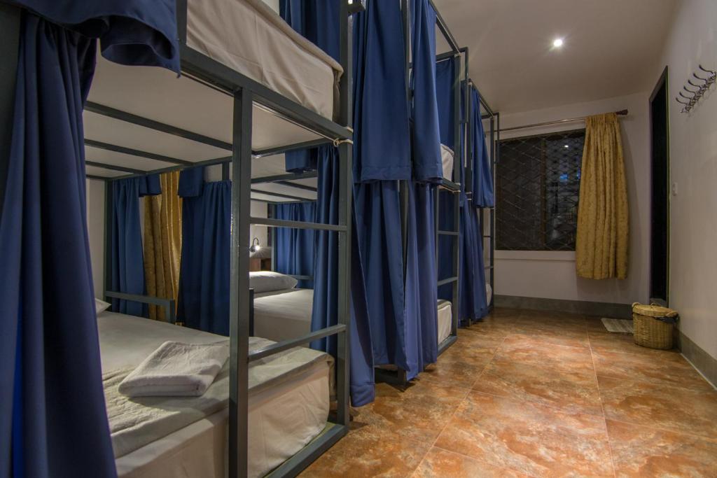 Postel nebo postele na pokoji v ubytování Bokre Angkor Hostel