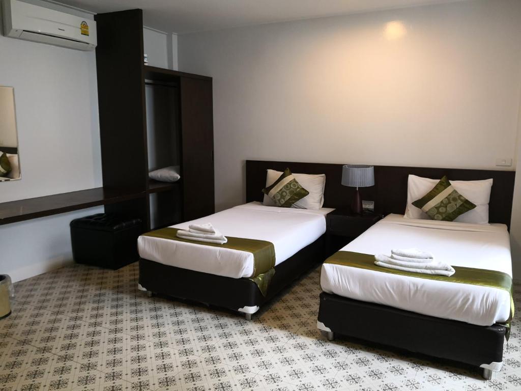 Postel nebo postele na pokoji v ubytování Chiangrai Green Park Resort