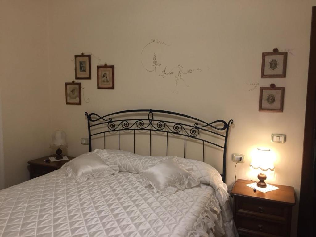 Łóżko lub łóżka w pokoju w obiekcie Casa Stella