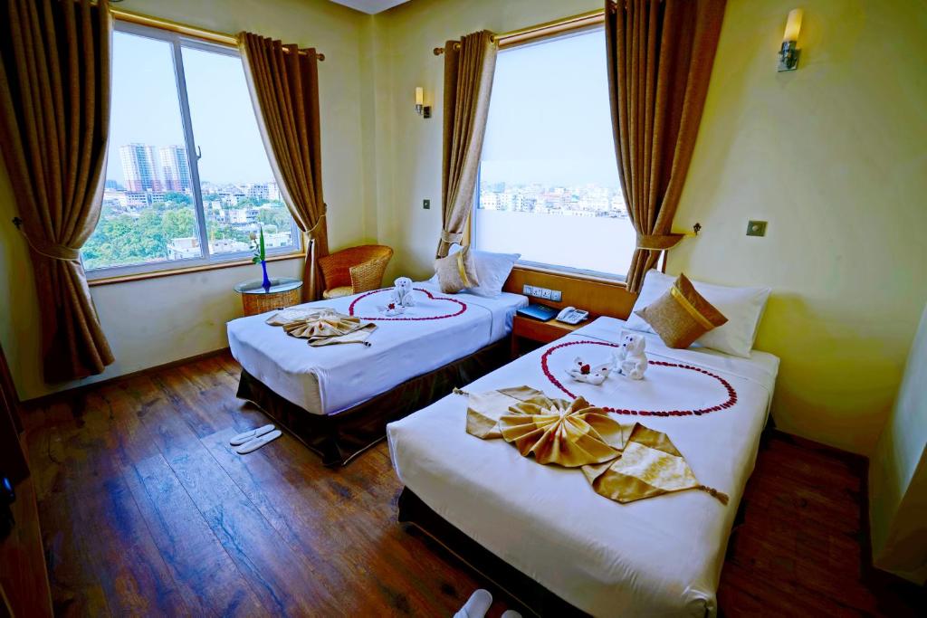 Postel nebo postele na pokoji v ubytování The Hotel Nova