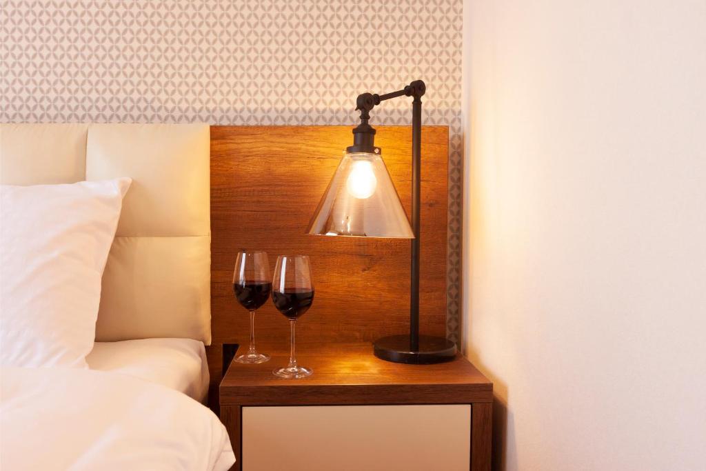 Postel nebo postele na pokoji v ubytování Hotel Amser