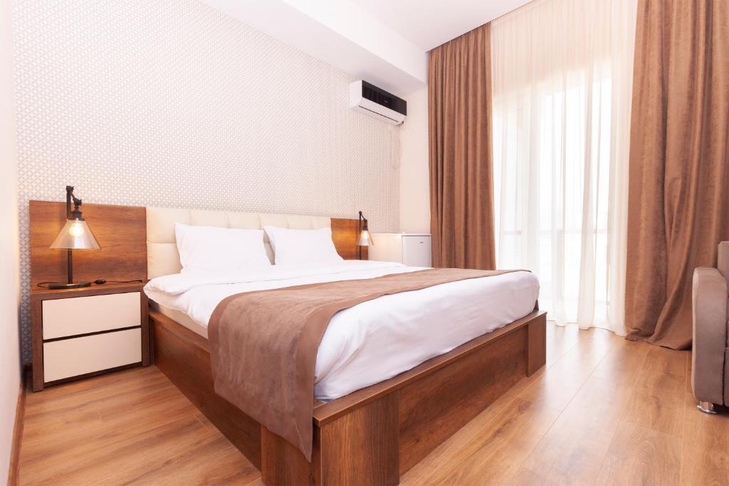 Postel nebo postele na pokoji v ubytování Hotel Amser