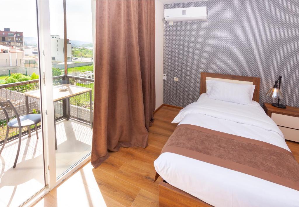 Postel nebo postele na pokoji v ubytování Hotel Amser