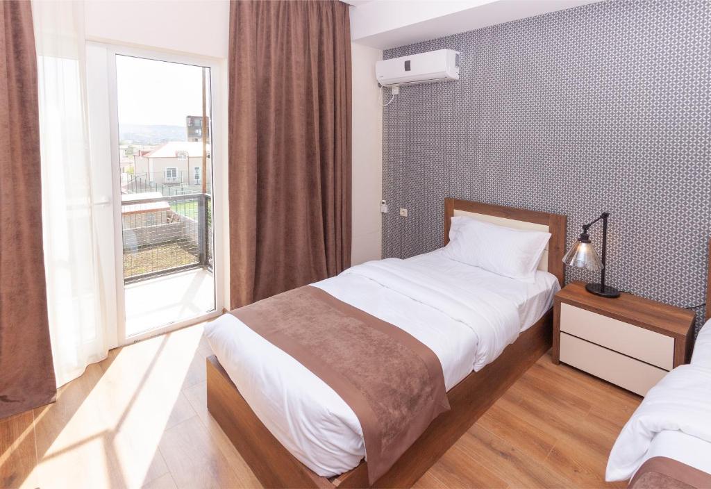 Postel nebo postele na pokoji v ubytování Hotel Amser