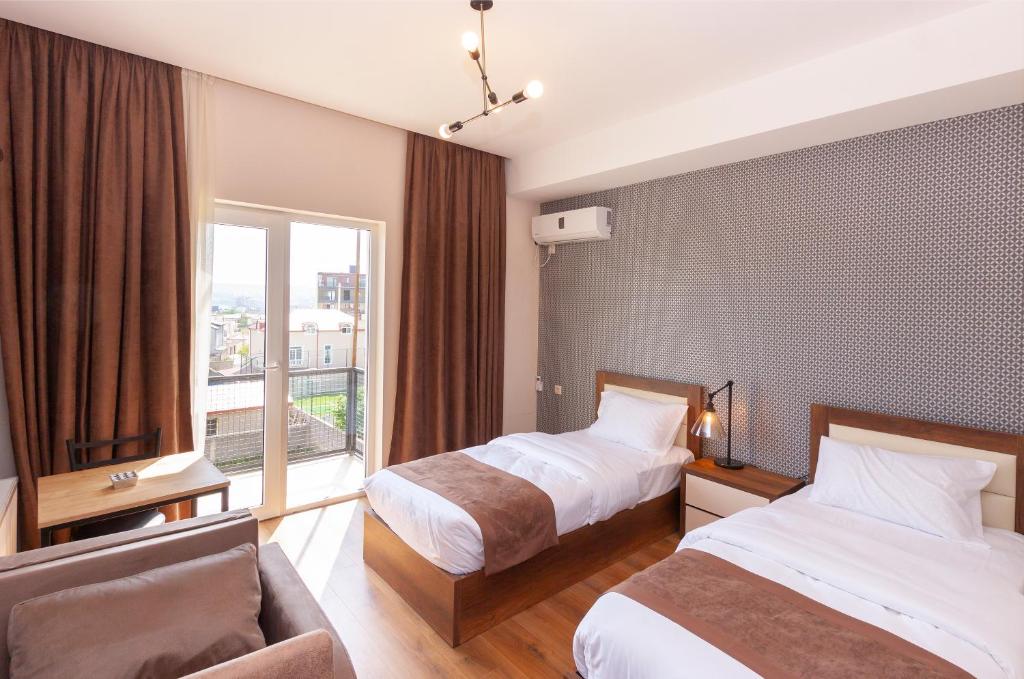 Postel nebo postele na pokoji v ubytování Hotel Amser