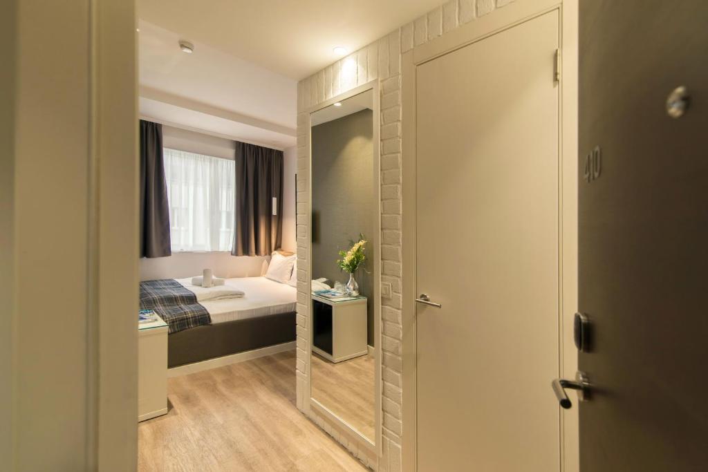 Krevet ili kreveti u jedinici u okviru objekta Belgrade Inn Garni Hotel