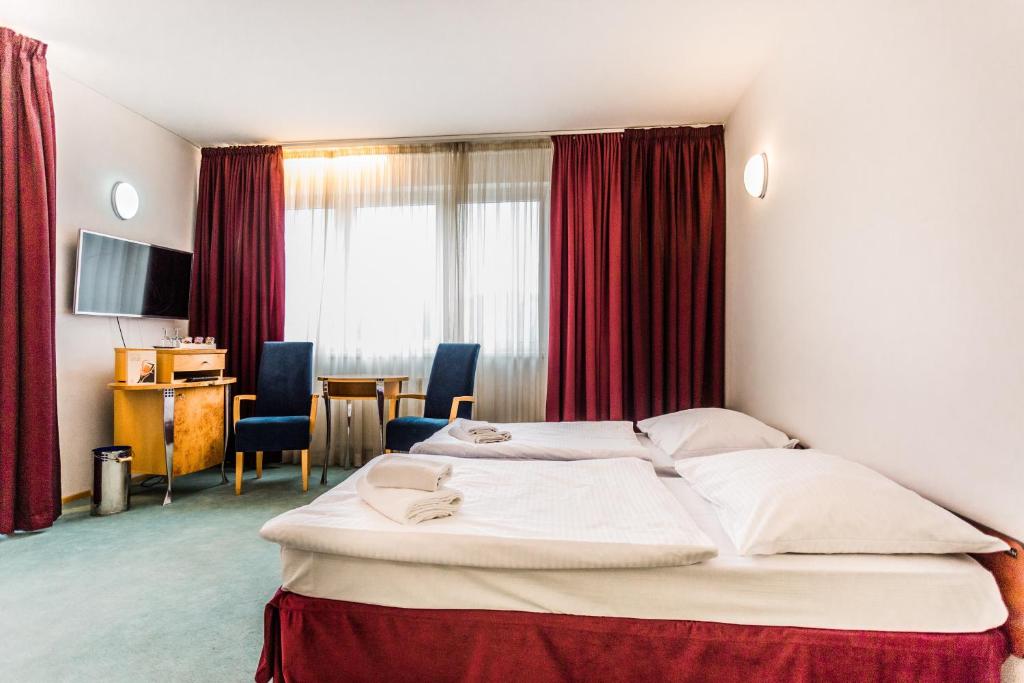 Postel nebo postele na pokoji v ubytování Hotel SET