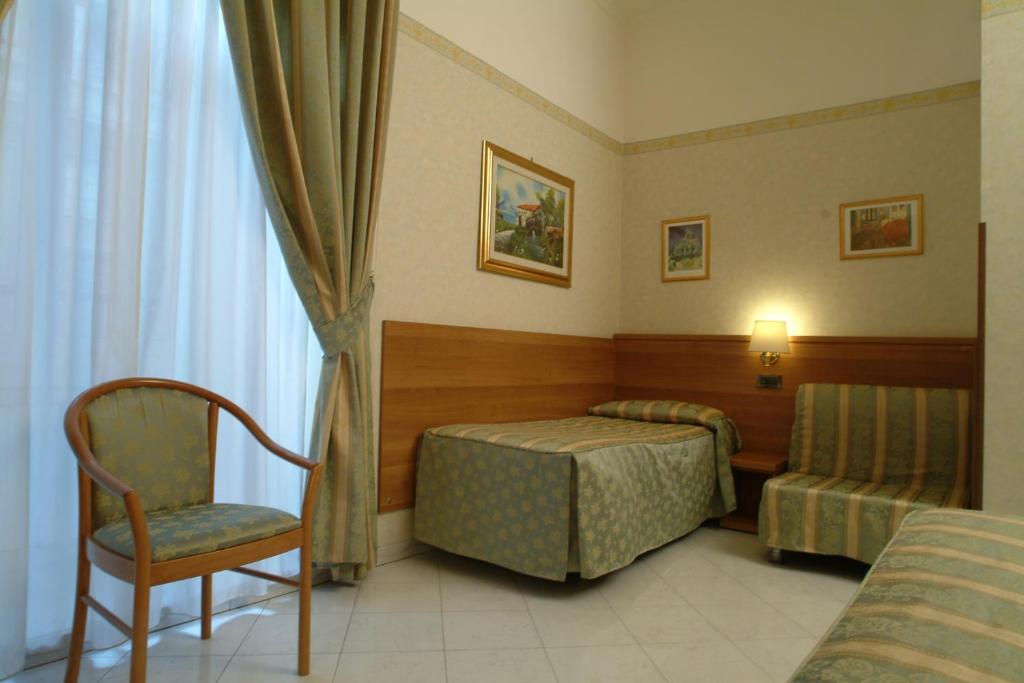 Postel nebo postele na pokoji v ubytování Hotel Teti