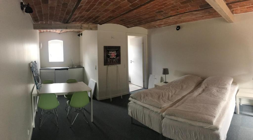 Postel nebo postele na pokoji v ubytování B & B Gødstrup - cafe og restaurant Den Gamle Stald