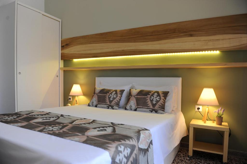 Łóżko lub łóżka w pokoju w obiekcie Stamatia Apartments