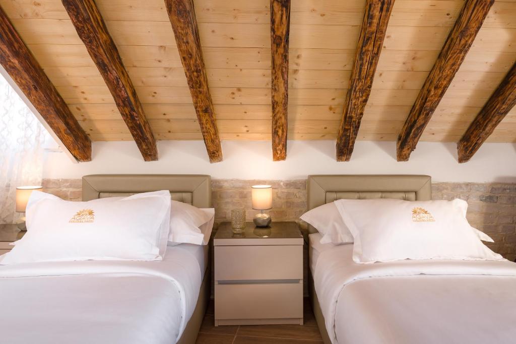Postel nebo postele na pokoji v ubytování Agava Lux Rooms&Pool