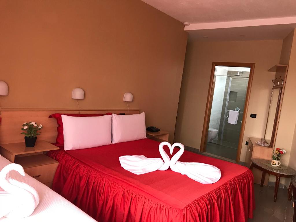 Postel nebo postele na pokoji v ubytování Hotel Nais