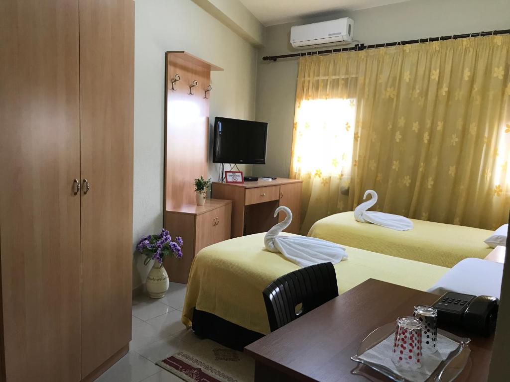 Postel nebo postele na pokoji v ubytování Hotel Nais