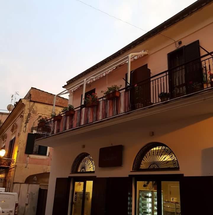 a building with a balcony with plants on it at Cerasella in Cetara
