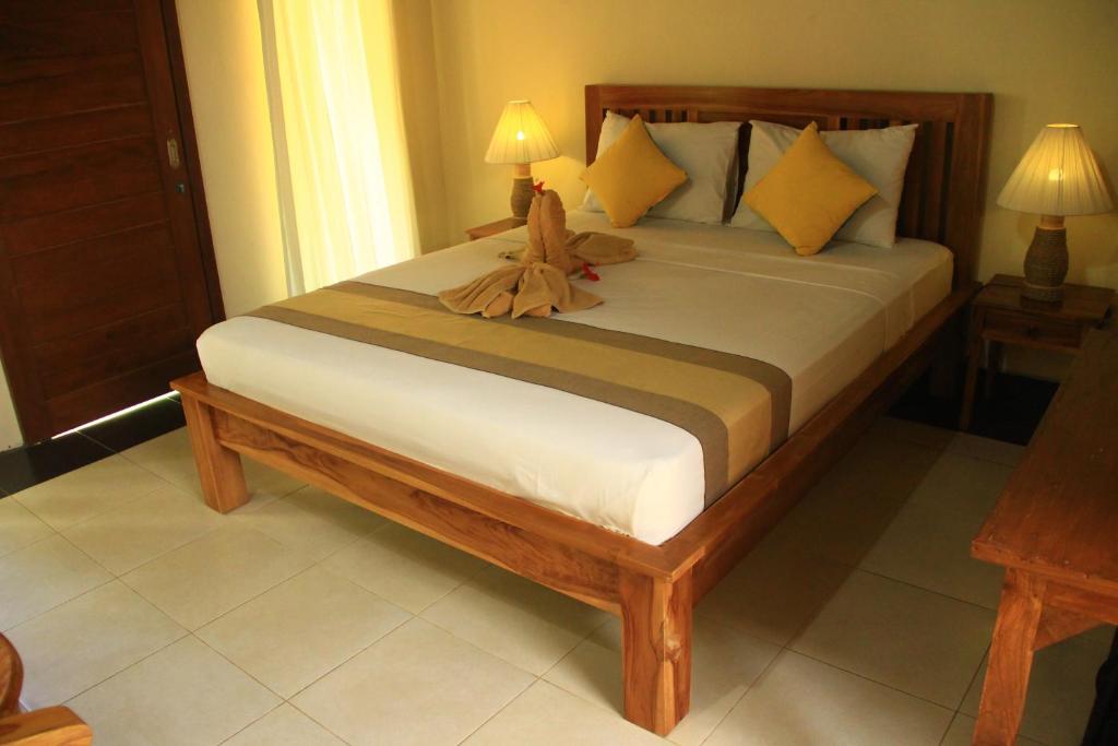 Postel nebo postele na pokoji v ubytování Ary House Ubud