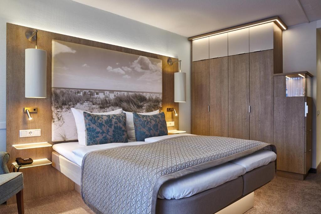 Postel nebo postele na pokoji v ubytování Hotel Strandidyll