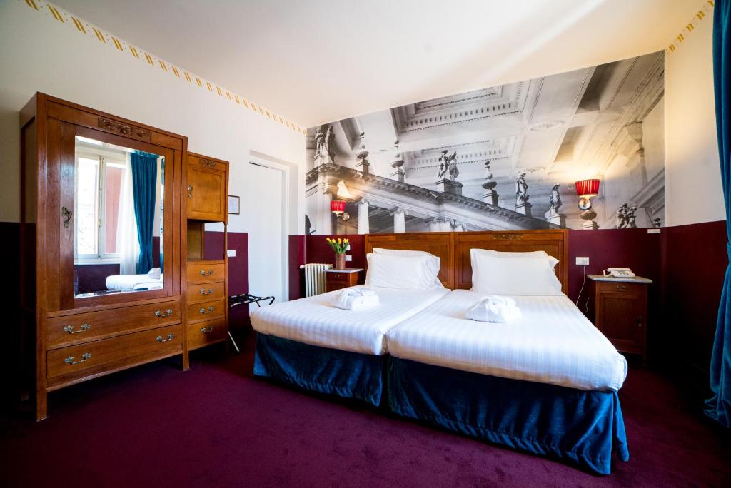 Postel nebo postele na pokoji v ubytování Antico Hotel Vicenza