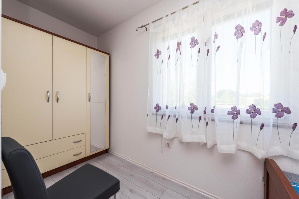 Posteľ alebo postele v izbe v ubytovaní Apartman Micko