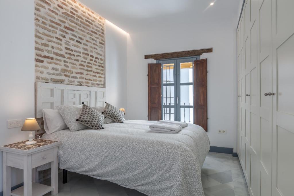 Postel nebo postele na pokoji v ubytování Casas de Sevilla - Apartamentos Tintes12