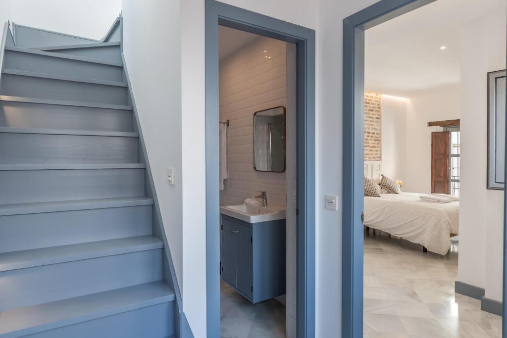 Postel nebo postele na pokoji v ubytování Casas de Sevilla - Apartamentos Tintes12