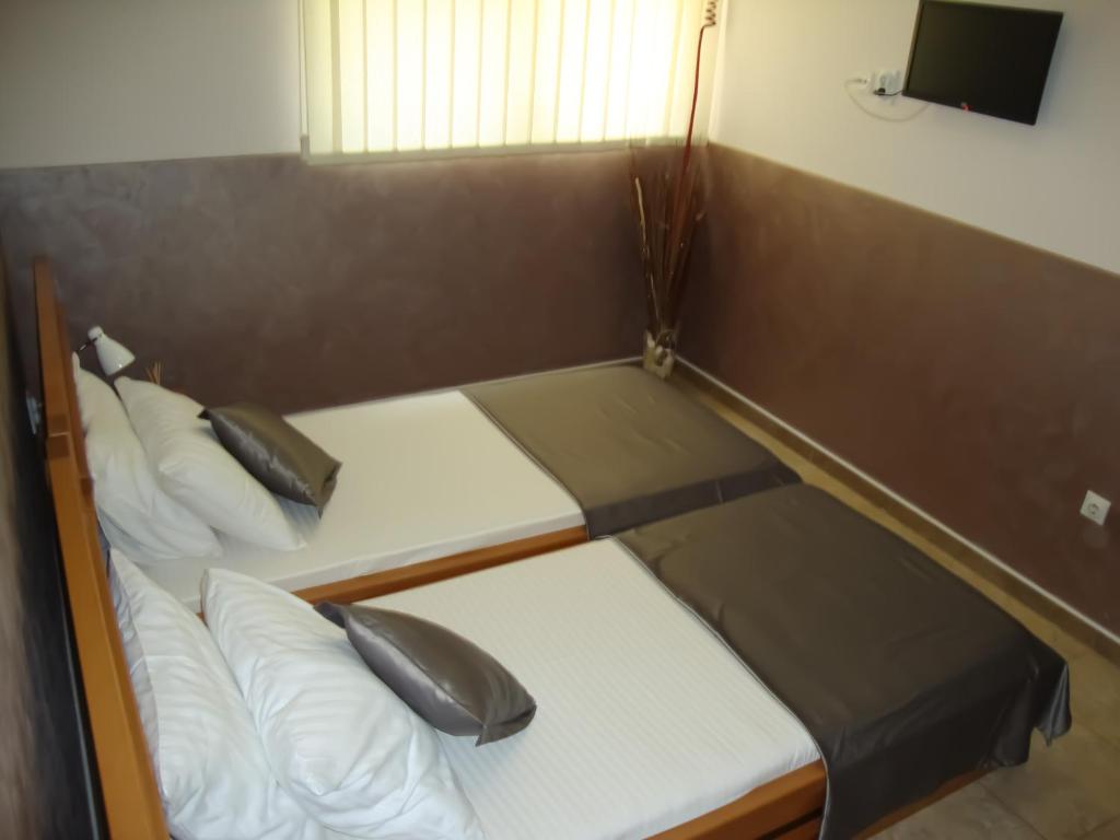 Postel nebo postele na pokoji v ubytování Smeštaj Olivera Niška Banja