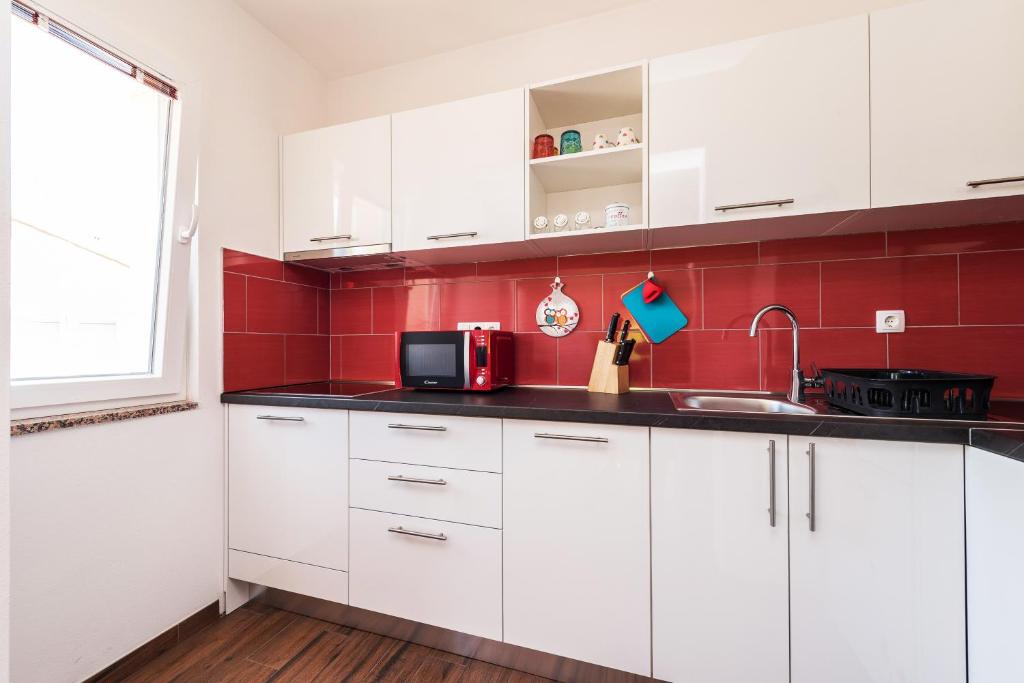 Kuchyňa alebo kuchynka v ubytovaní Apartman Micko