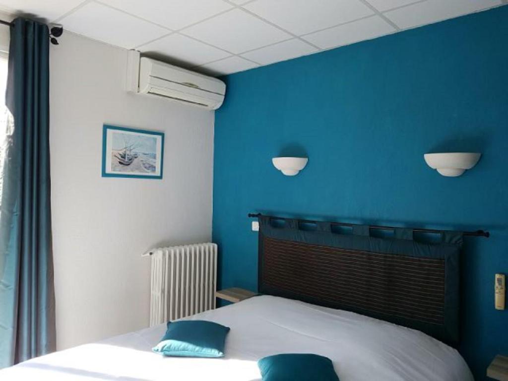 Posteľ alebo postele v izbe v ubytovaní Carry Hotel