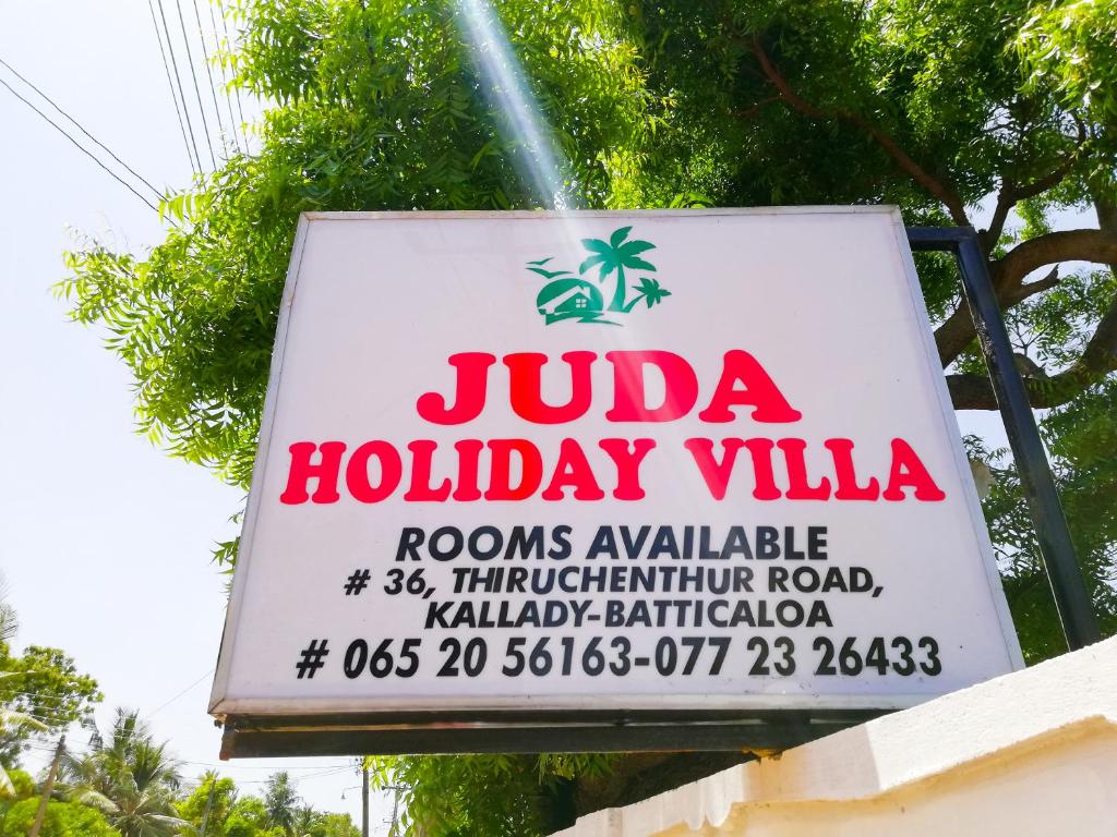 a sign for a jula hollywood villa at Juda Holiday Villa in Batticaloa