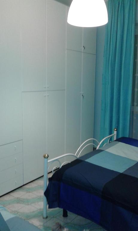 A bed or beds in a room at Appartamento Lauretta