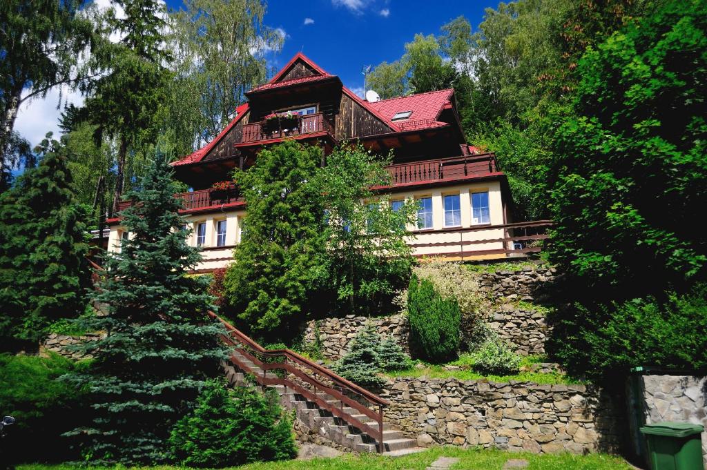 a house on top of a stone wall at Marsjanka in Szczyrk