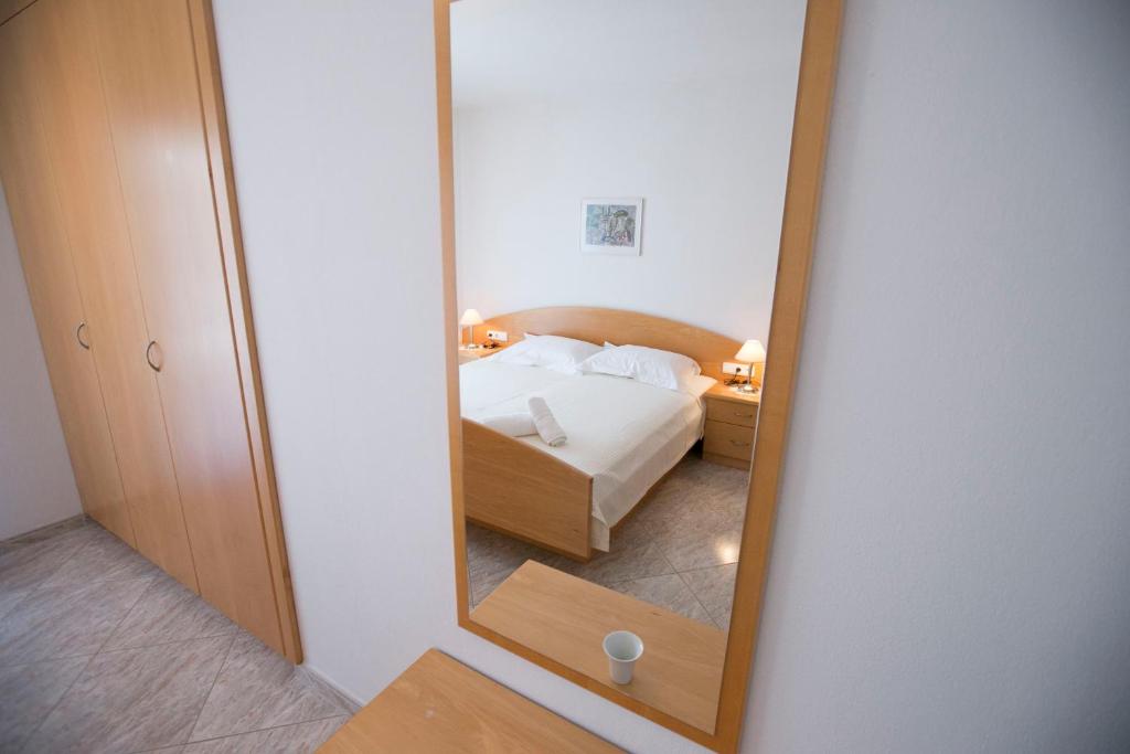 Postel nebo postele na pokoji v ubytování Susanna Apartments