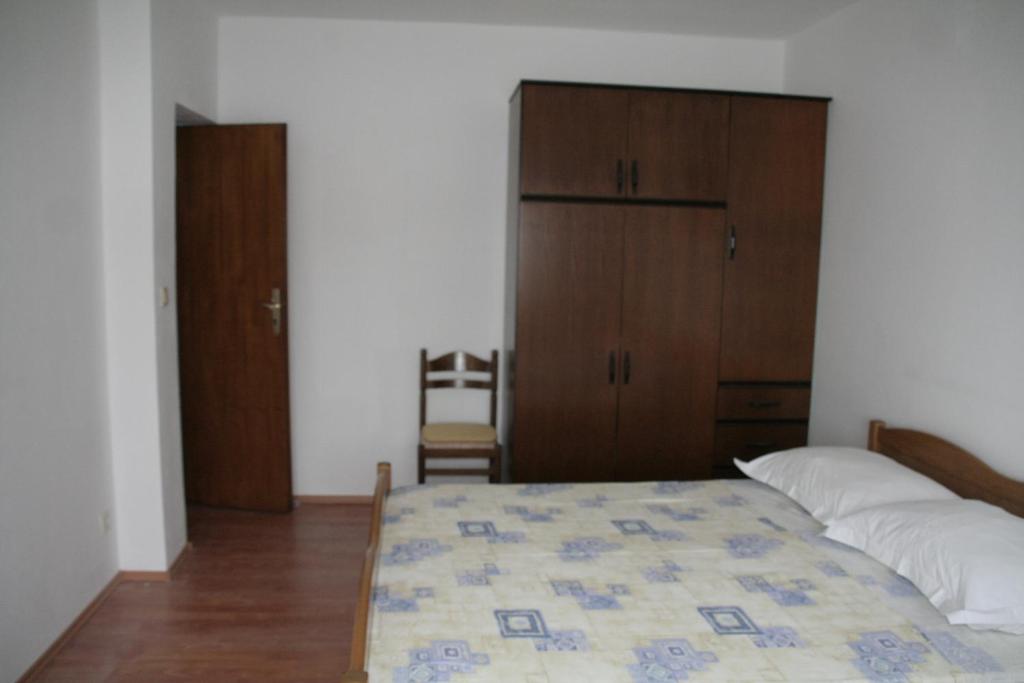 Postel nebo postele na pokoji v ubytování Apartmani Huljev