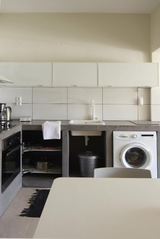 A kitchen or kitchenette at Christini Apartment