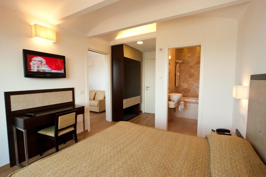 Postel nebo postele na pokoji v ubytování Hotel Joli