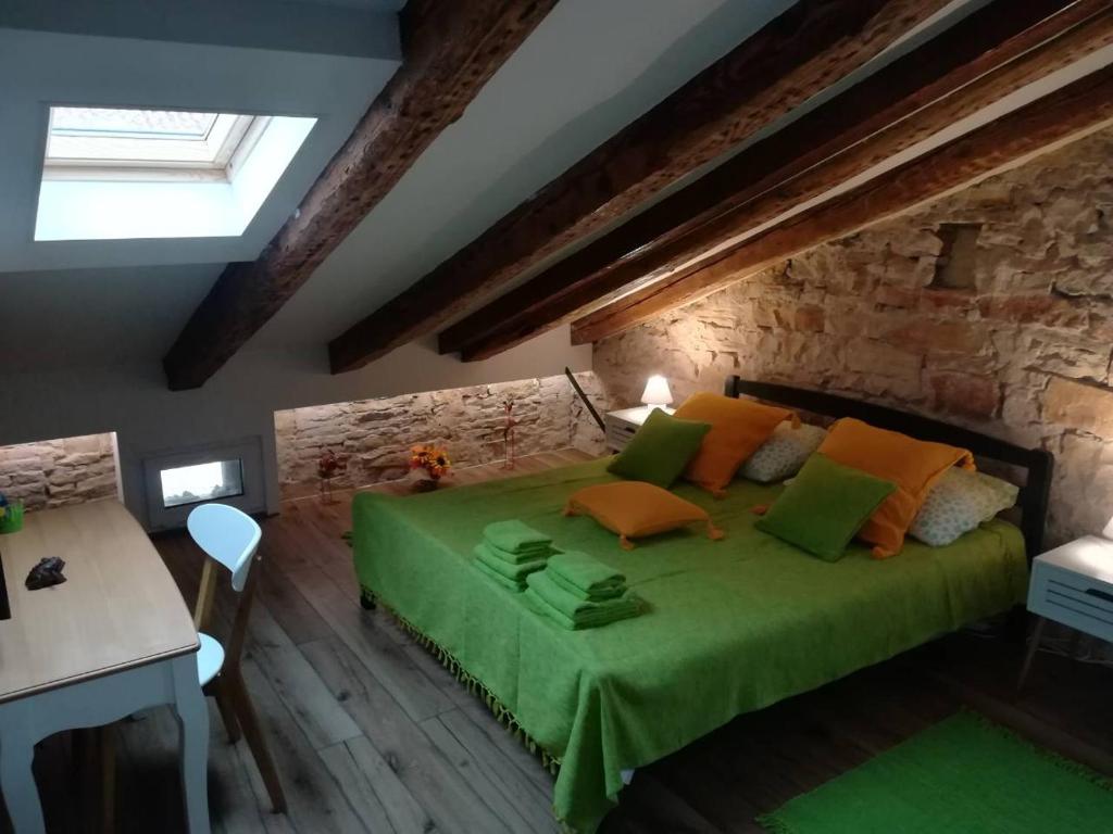 a bedroom with a bed and a window at LukaDora in Pula