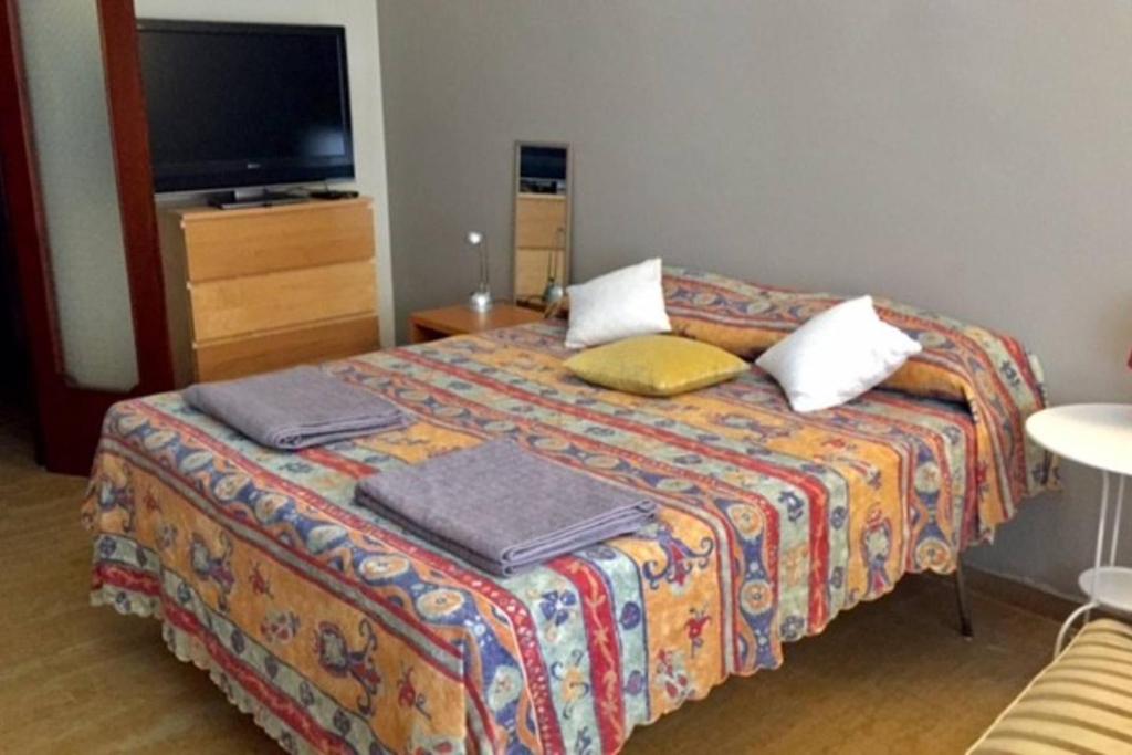 A bed or beds in a room at Roma Cinecittà Free WI-FI